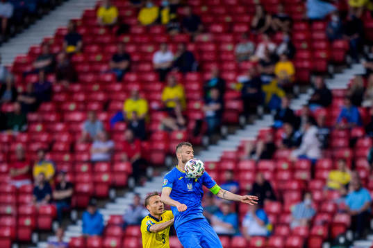 Pierre Bengtsson of Sweden and Andriy Yarmolenko of Ukraine
