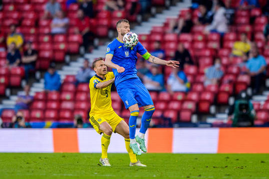 Pierre Bengtsson of Sweden and Andriy Yarmolenko of Ukraine