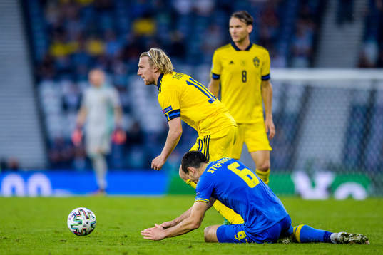 Emil Forsberg of Sweden and Taras Stepanenko of Ukraine