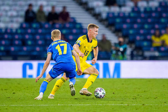 Emil Krafth of Sweden and Oleksandr Zinchenko of Ukraine
