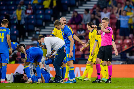 Marcus Danielson of Sweden receives a red card from referee