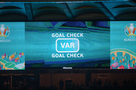 A big screen with the text Goal check
