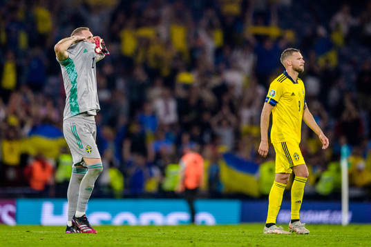 goalkeeper Robin Olsen and Marcus Berg of Sweden look
