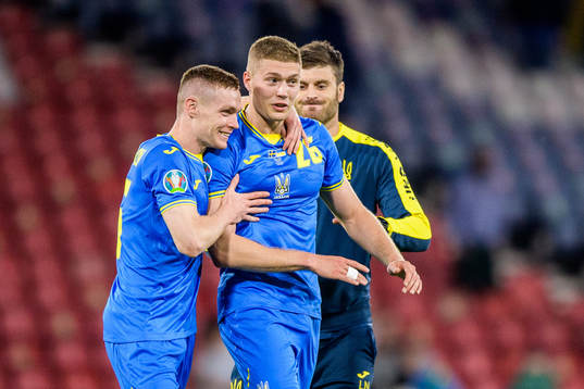 Viktor Tsygankov and Artem Dovbyk of Ukraine celebrate