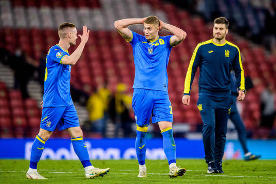 Viktor Tsygankov and Artem Dovbyk of Ukraine celebrate