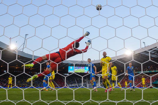 Goalkeeper Georgiy Bushchan of Ukraine makes a save in