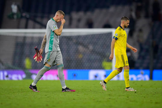 Goalkeeper Robin Olsen and Marcus Berg of Sweden look