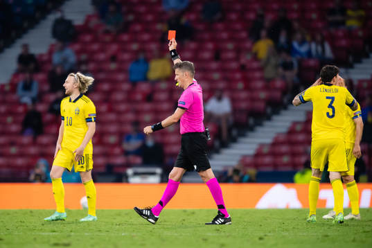 Marcus Danielson (not in picture) of Sweden gets a red card