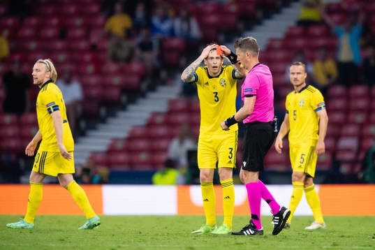 Marcus Danielson (not in picture) of Sweden gets a red card