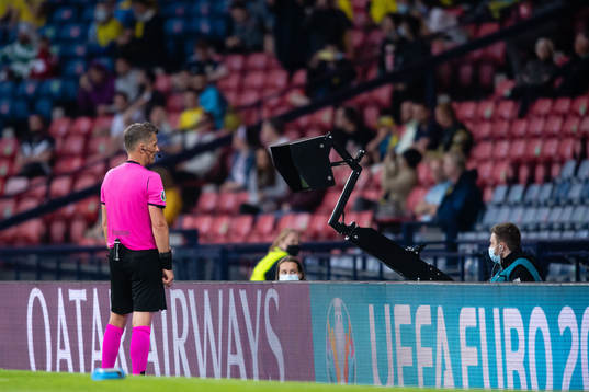 Referee Daniele Orsato do a VAR-check