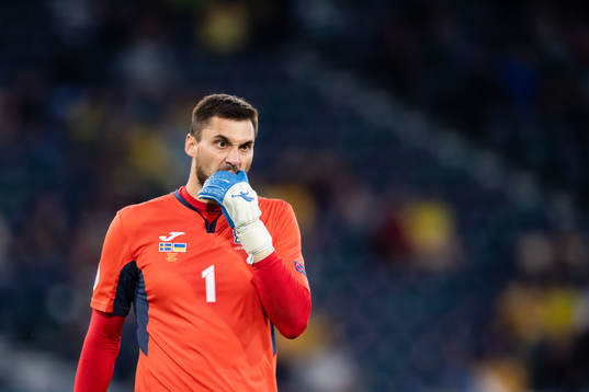 Goalkeeper Georgiy Bushchan of Ukraine looks dejected