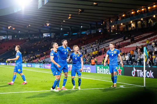 Roman Yaremchuk of Ukraine celebrates with teammates