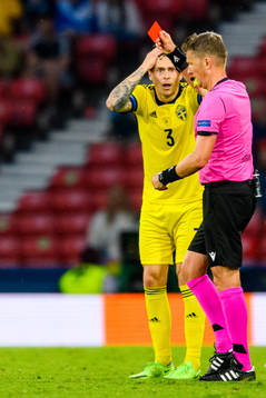 Victor Nilsson Lindelöf of Sweden reacts to a red card