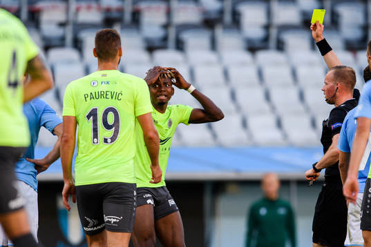 Yunusa Owolabi Muritala of Riga receives his second yellow