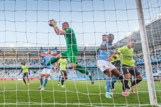 Goalkeeper Roberts Ozols of Riga and Amin Sarr of Malmö FF