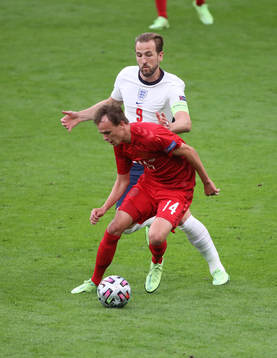 Mikkel Damsgaard of Denmark and Harry Kane of England