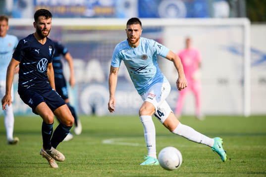 Erdal Rakip of Malmö FF and Nedeljko Piscevic of Riga