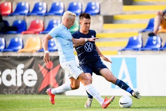 Mikael Soisalo of Riga and Jonas Knudsen of Malmö FF