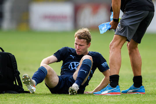 Oscar Lewicki of Malmö FF receives medicinal treatment