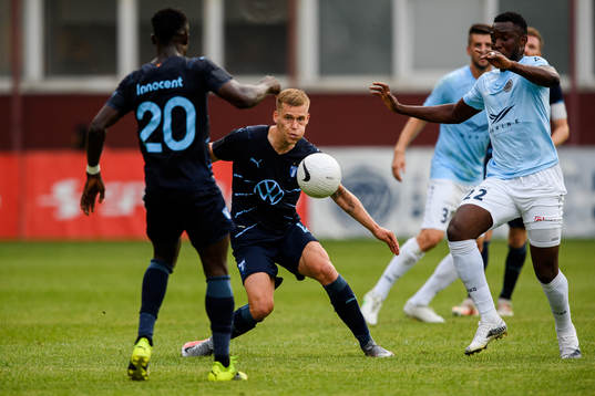 Felix Beijmo of Malmö FF and Mbomo Kule of Riga