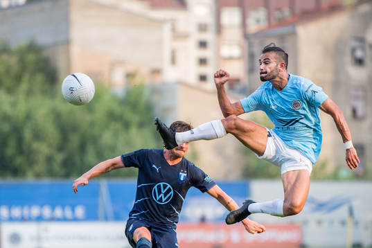 Felipe Brisola of Riga and Eric Larsson of Malmö FF