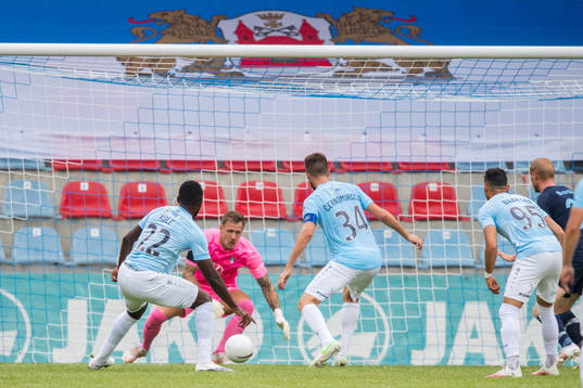 Mbomo Kule and Antonijs Cernomordijs of Riga with a chance