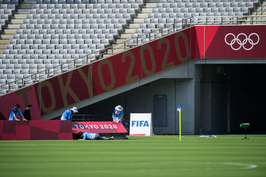 Crew adjust boards at Tokyo Stadium