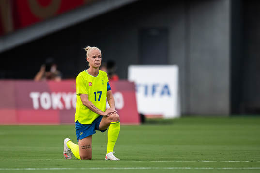 Caroline Seger of Sweden kneel