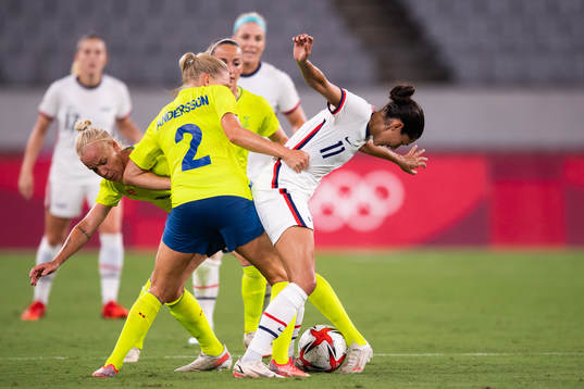 Christen Press of USA tries to get pass Caroline Seger and
