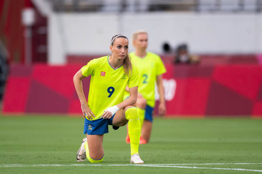 Kosovare Asllani of Sweden kneels