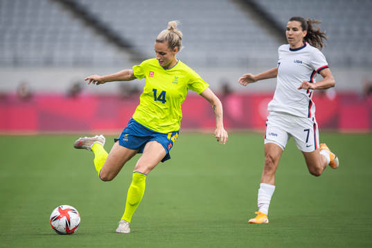 Nathalie Björn of Sweden and Tobin Heath of USA