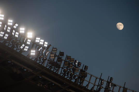 The moon is seen from the stadium