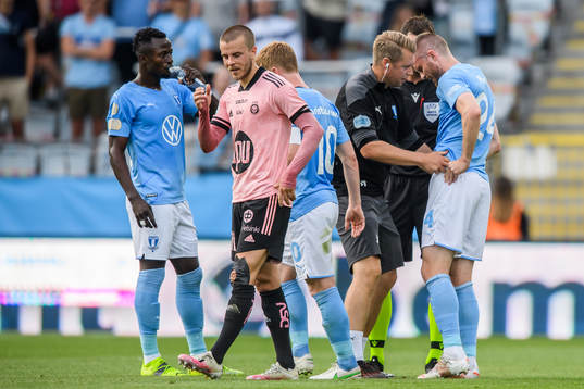 Lasse Nielsen of Malmö FF recieve medical attention