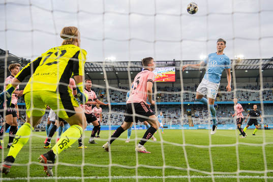 Anel Ahmedhodzic of Malmö FF against goalkeeper Jakob