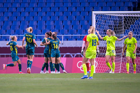 Sam Kerr of Australia celebrates together with teammates