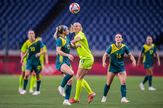 Ellie Carpenter of Australia and Stina Blackstenius of