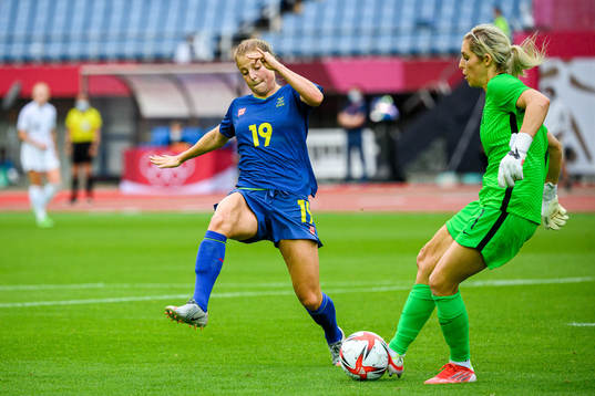 Anna Anvegård of Sweden and goalkeeper Erin Nayler of New
