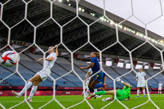 Madelen Janogy of Sweden scores the 0-2 goal behind