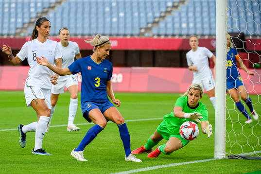 Emma Kullberg of Sweden against goalkeeper Erin Nayler of