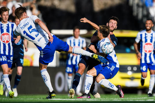 Erdal Rakip of Malmö FF against Miro Tenho and Filip