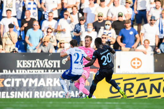 David Browne of Helsinki and goalkeeper Johan Dahlin of