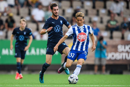 Adi Nalic of Malmö FF and Atomu Tanaka of Helsinki