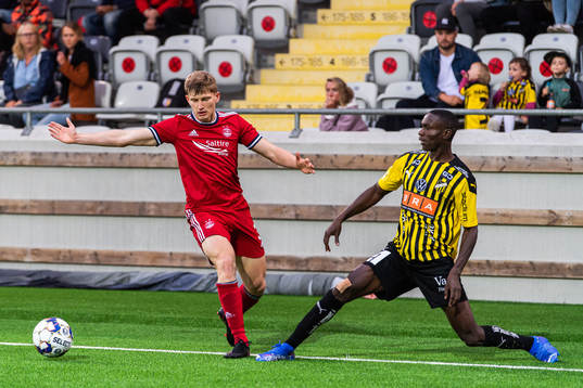 Jack Mackenzie of Aberdeen and Godswill Ekpolo  of Häcken