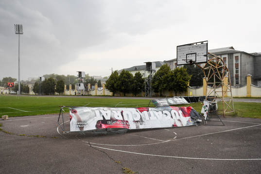 Commercial signs blow away in heavy winds