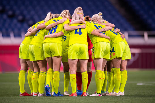 Players of Sweden gather in the women's football match