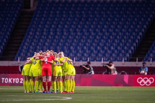 Players of Sweden gather in the women's football match