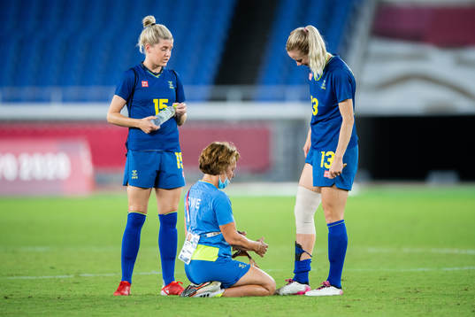 Amanda Ilestedt of Sweden gets her right knee bandaged