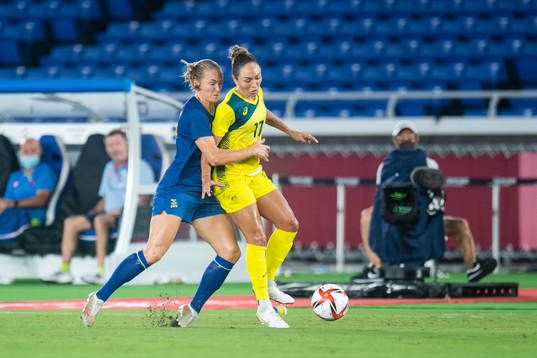 Magdalena Eriksson of Sweden and Kyah Simon of Australia in
