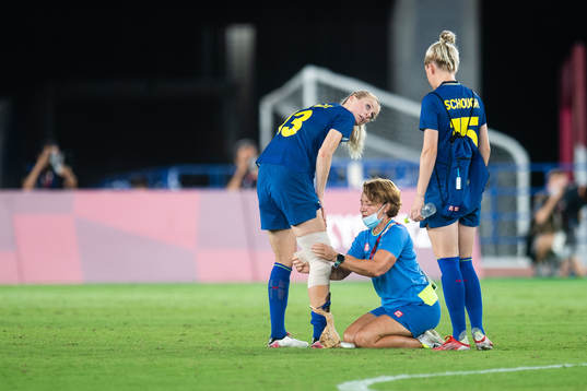 Amanda Ilestedt of Sweden gets her right knee bandaged