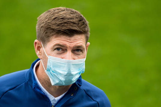 Steven Gerrard, head coach of Rangers inspect the pitch